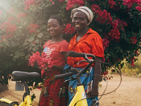 Secondary student Vanessa and her mother, with Vanessa’s new bicycle