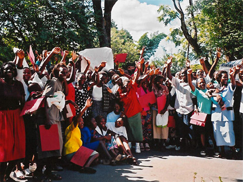 A group of Zimbabwean CAMFED Association members celebrating