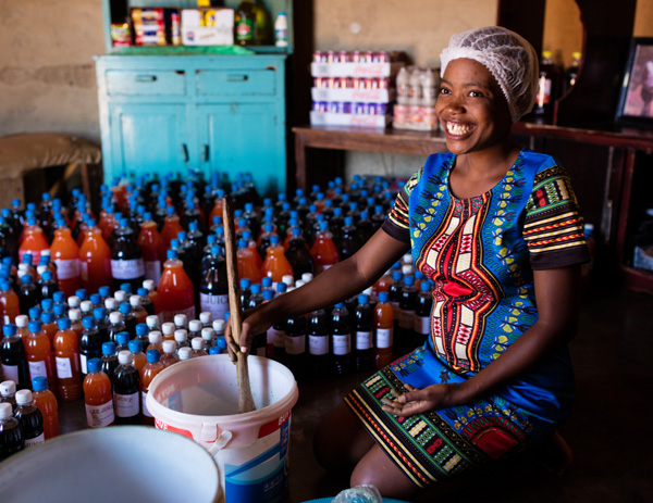 Camfed alumna Lindiwe produces 2,000 two-litre bottles of juice a month