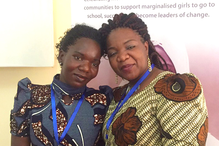Camfed alumna Aida with Regional Director and alumna Angeline Murimirwa