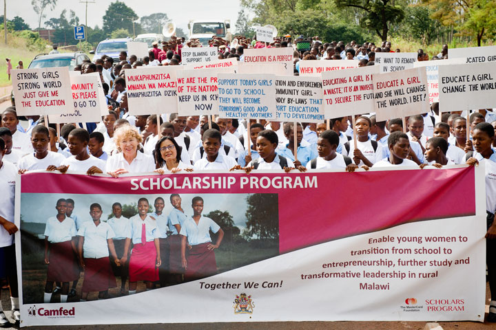 Malawian students and their communities celebrate the launch of the 10-year partnership