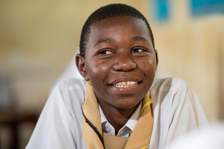 Camfed-supported student Catherine in class