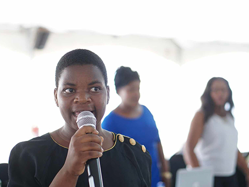 Eliza Chikoti with microphone