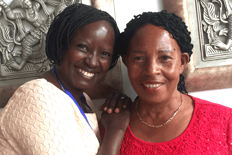Lydia Wilbard with Anna Bituro, a nurse and one of Camfed Tanzania’s first district partners 