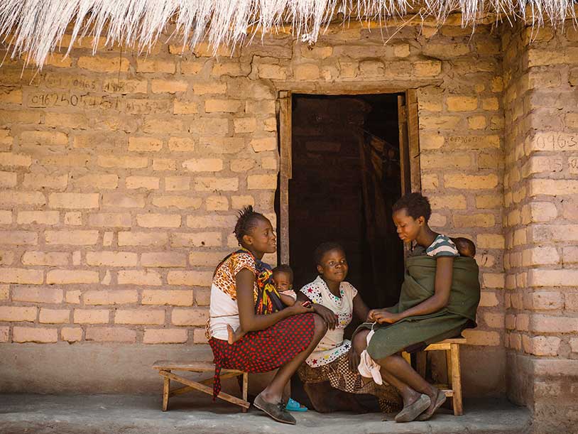 Mary sitting and talking with her friends
