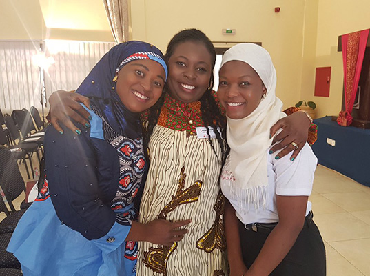Nurse Fatima and medical student Ruhia with Dolores Dickson