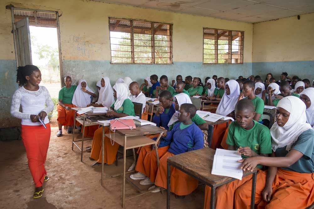 Learner Guide Shani speaks to a class at secondary school in Bagamoyo, Tanzania