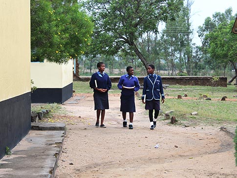 Aneni walking with two friends