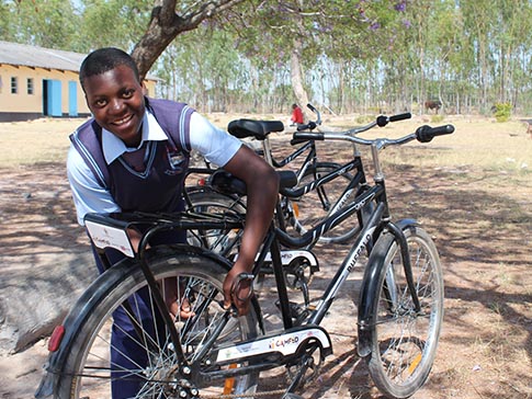 Aneni is proud of her new bike. Aneni is proud of her new bike.