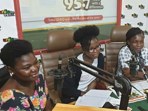 Young women lead a radio broadcast 