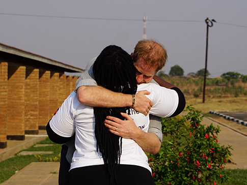 The Duke of Sussex hugs Angie Murimirwa The Duke of Sussex hugs Angie Murimirwa