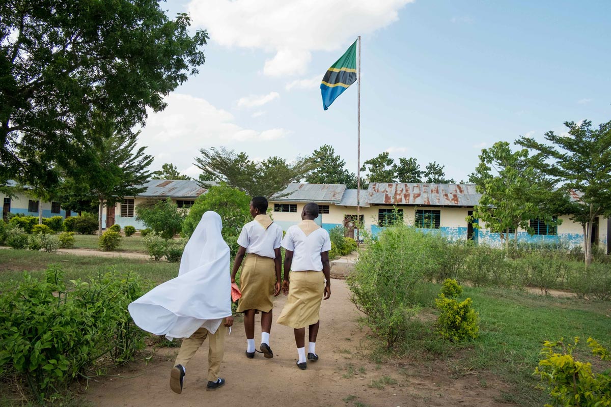 Sharifa walking into school with her classmates