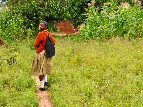 Now a boarder, Vumilia no longer has a 6 mile walk to school Before becoming a boarder, Vumilia started her 10 km walk to school at 4.30 a.m. every day