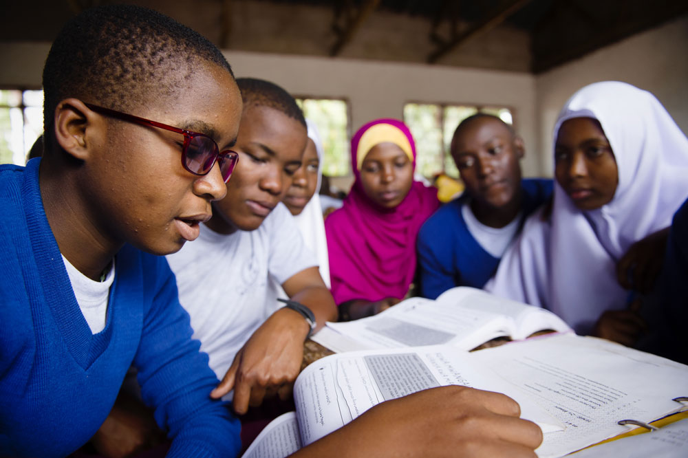 Students in Tanzania working collaboratively on the Camfed life skills curriculum