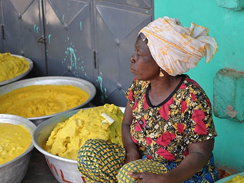 A member of a women’s cooperative selling shea butter produced in northern Ghana